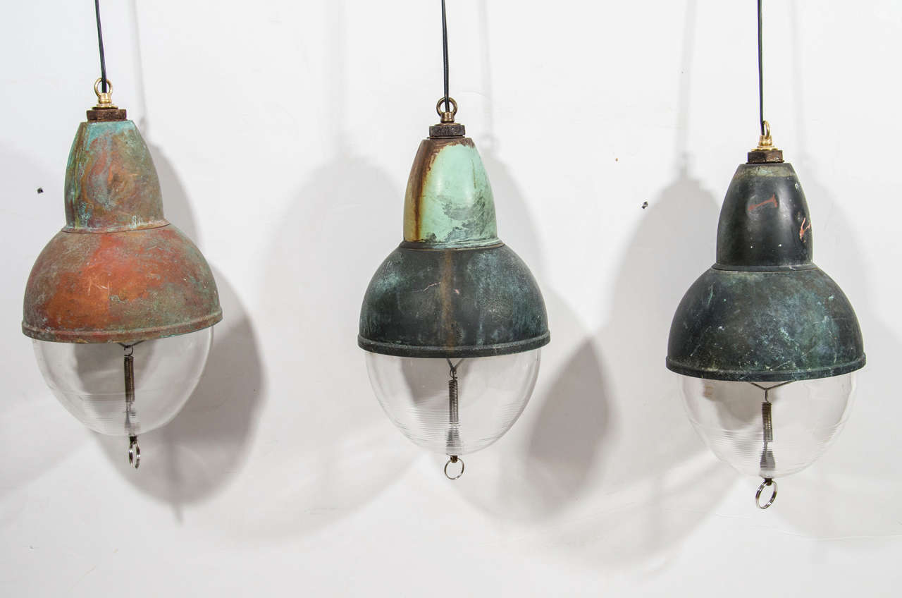 Antique pendant lights with green bronze patina. Three available.